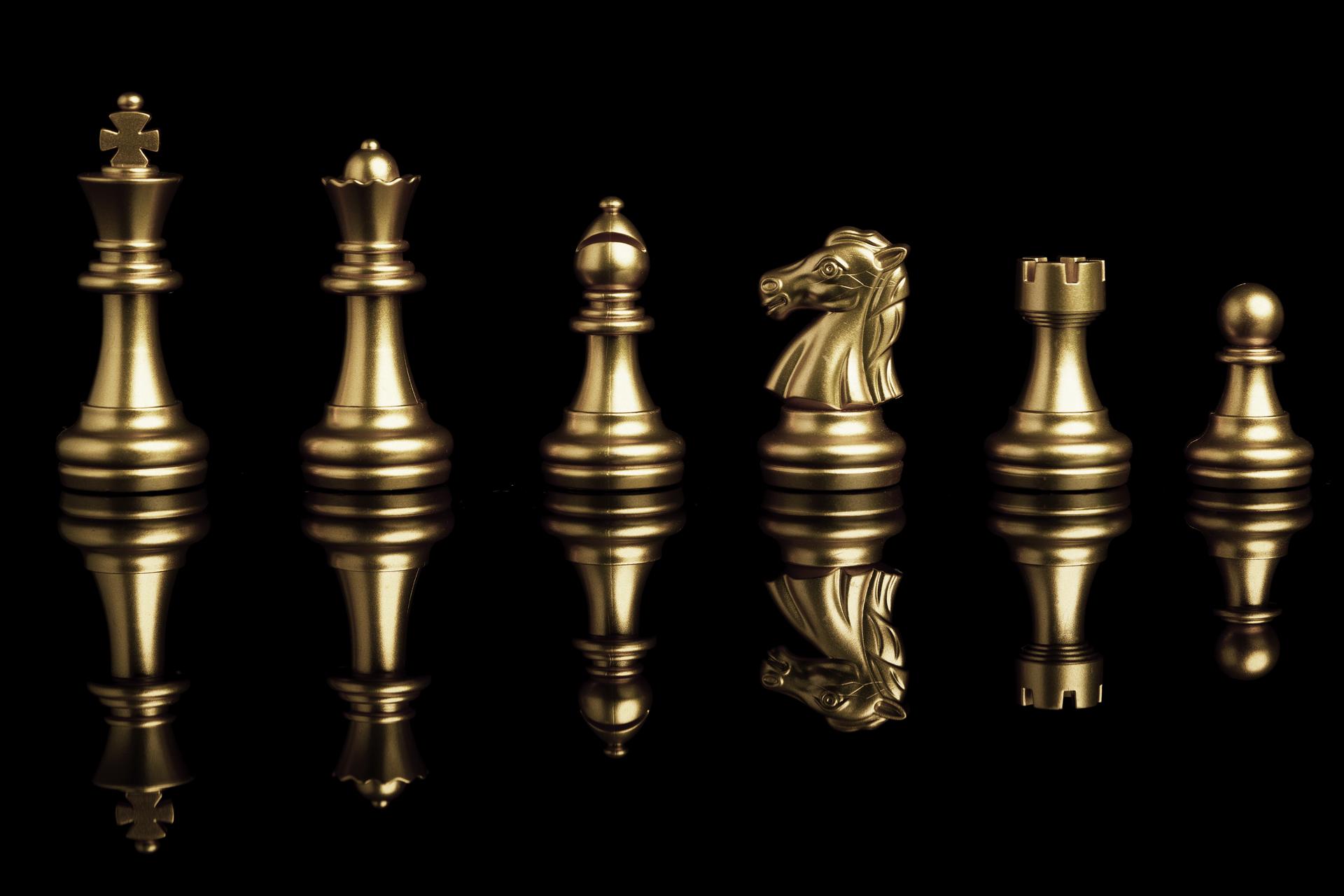 Golden chess pieces including king queen and knight representing diverse skill set